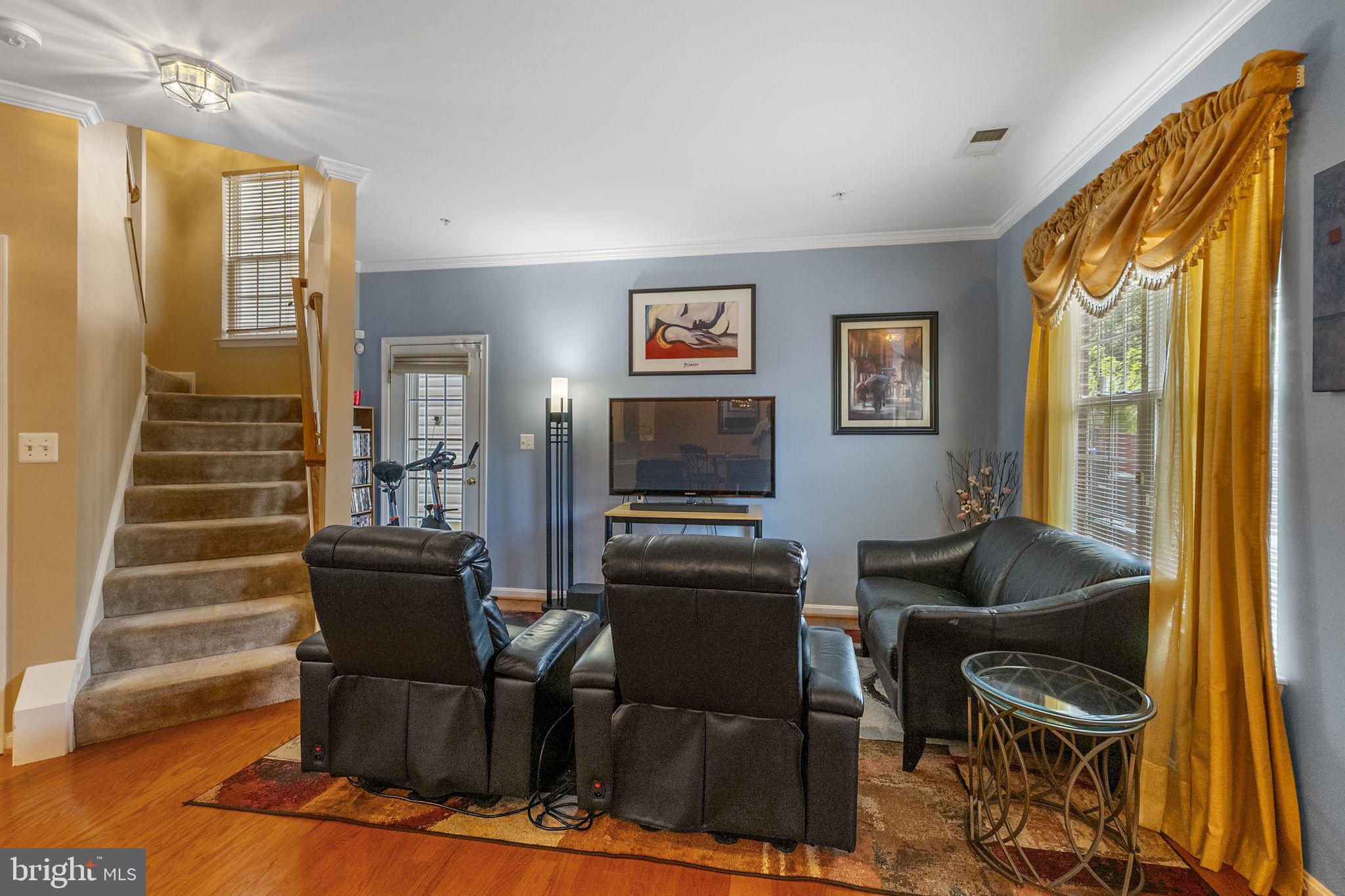 127 Mountain Creek Circle Frederick, MD 21702 - Photo 10 of 26 a living room with furniture and a flat screen tv