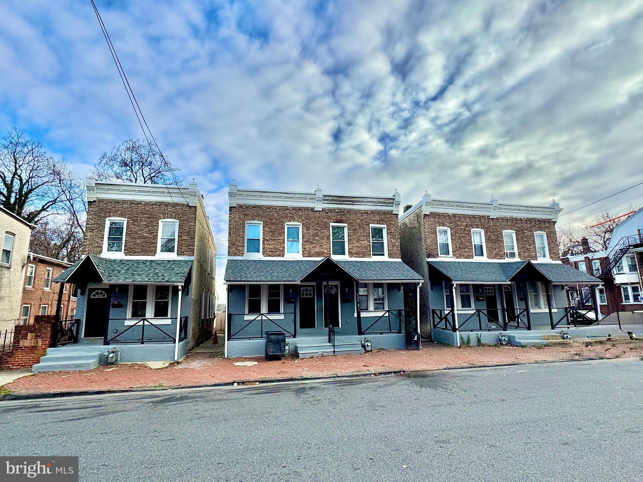 921 West 3rd Street Chester, PA 19013 - Photo 1 of 18 a front view of a brick building with many windows