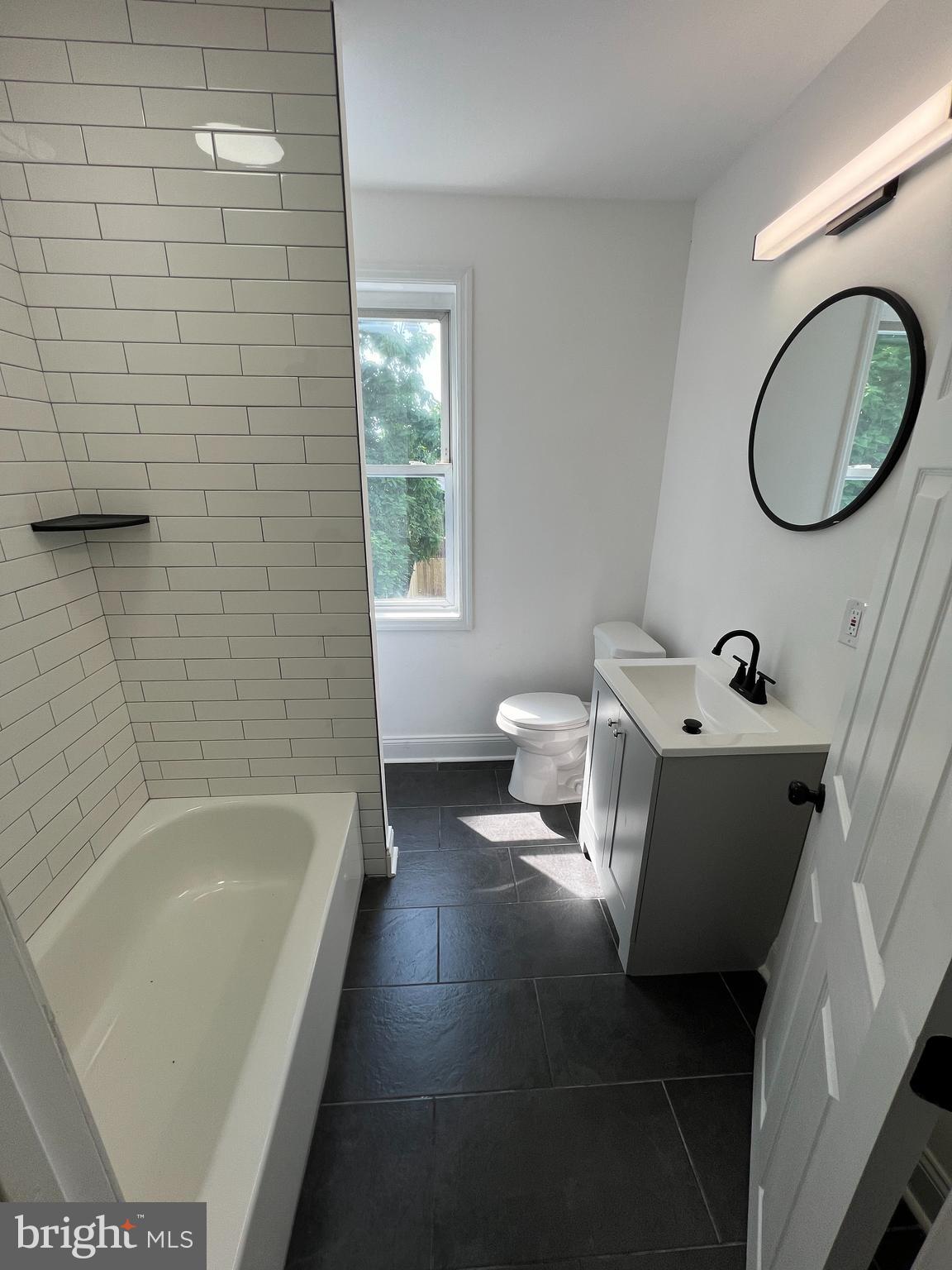 921 West 3rd Street Chester, PA 19013 - Photo 3 of 18 a bathroom with a bathtub and a sink