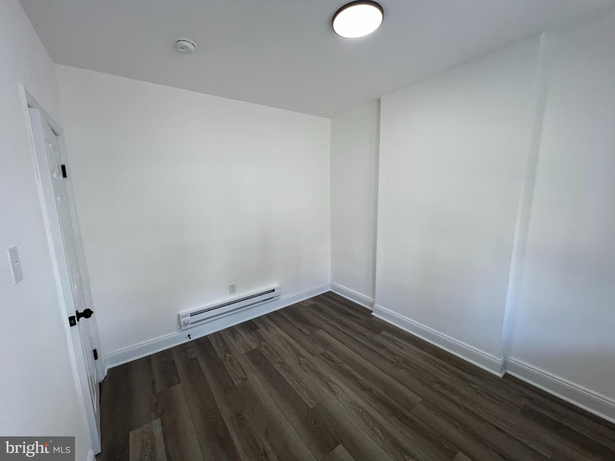 921 West 3rd Street Chester, PA 19013 - Photo 6 of 18 a view of room with wooden floor