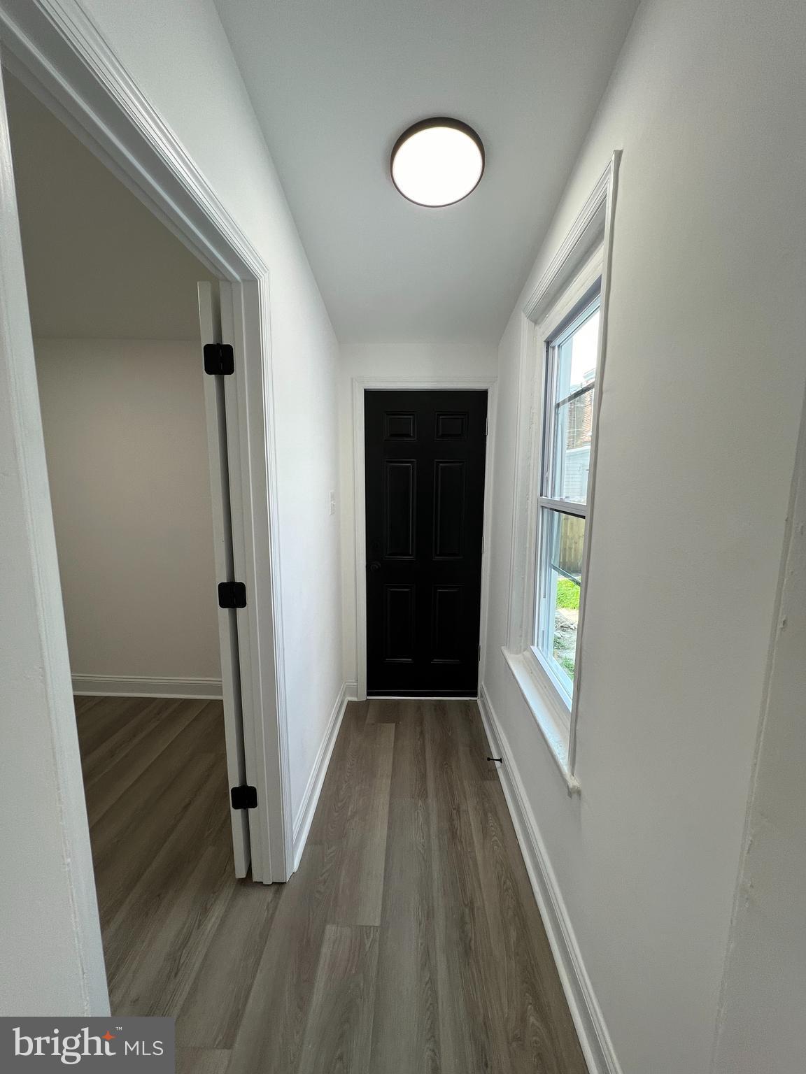 921 West 3rd Street Chester, PA 19013 - Photo 9 of 18 a view of hallway with window and wooden floor