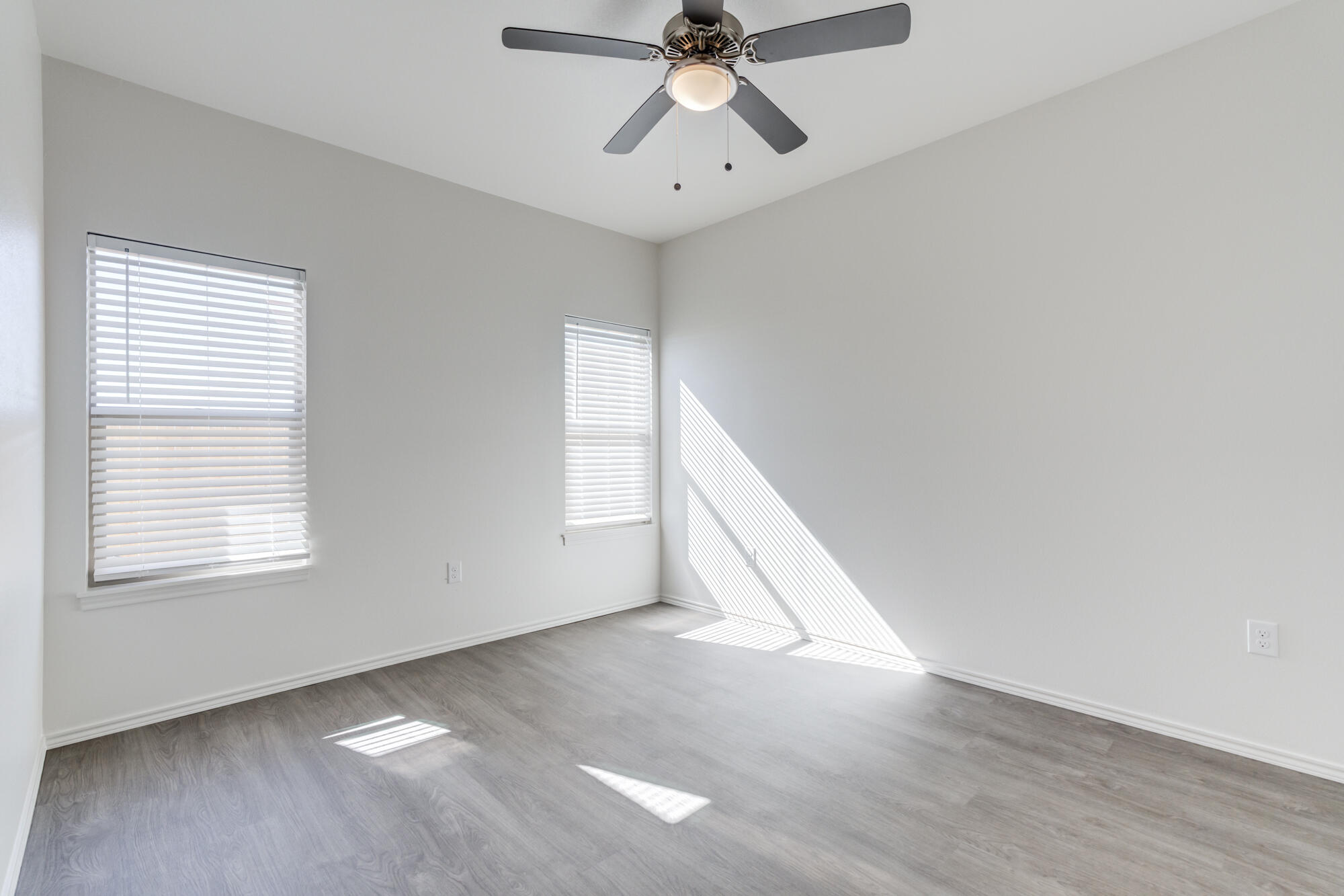 7007 40th Street Lubbock, TX 79407 - Photo 21 of 30 a view of an empty room and chandelier fan