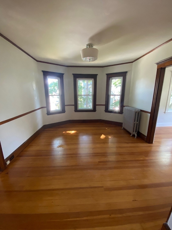 14 Welton Road Boston, MA 02132 - Photo 21 of 31 a view of room with window and hardwood floor