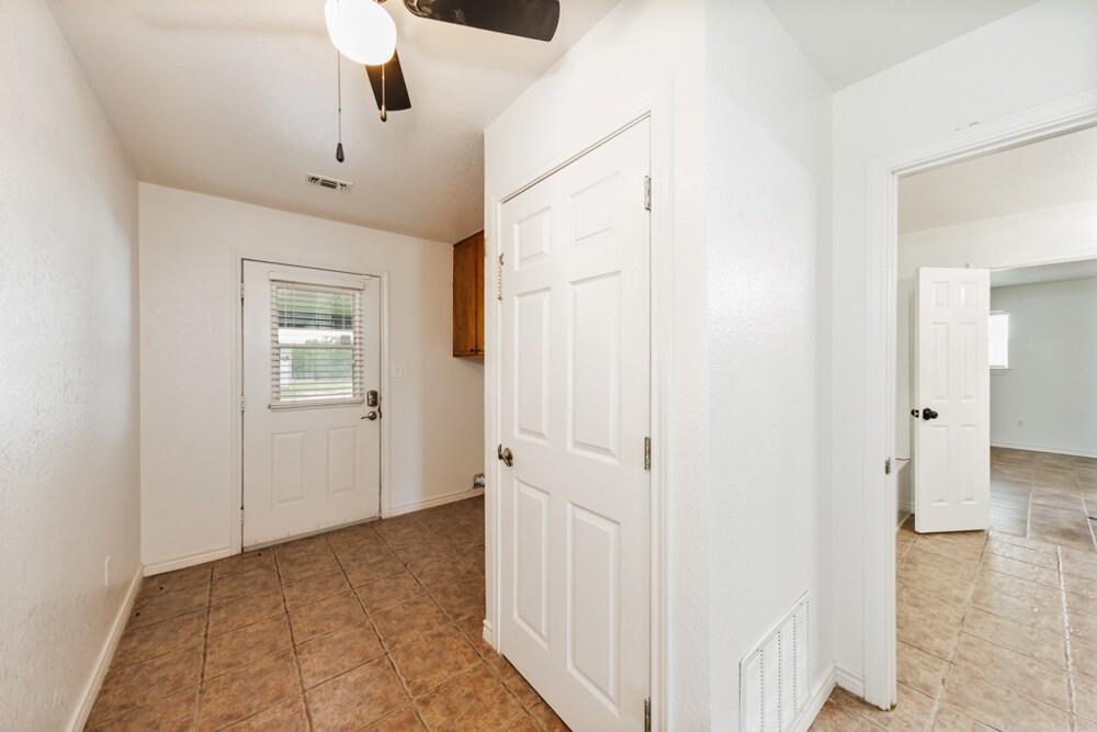 4316 Leona Road Bowie, TX 76230 - Photo 13 of 37 a view of a hallway to rooms