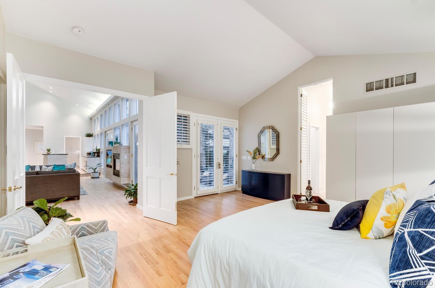 27 Hyde Park Circle Denver, CO 80209 - Photo 18 of 40 a bedroom with a bed and a couch