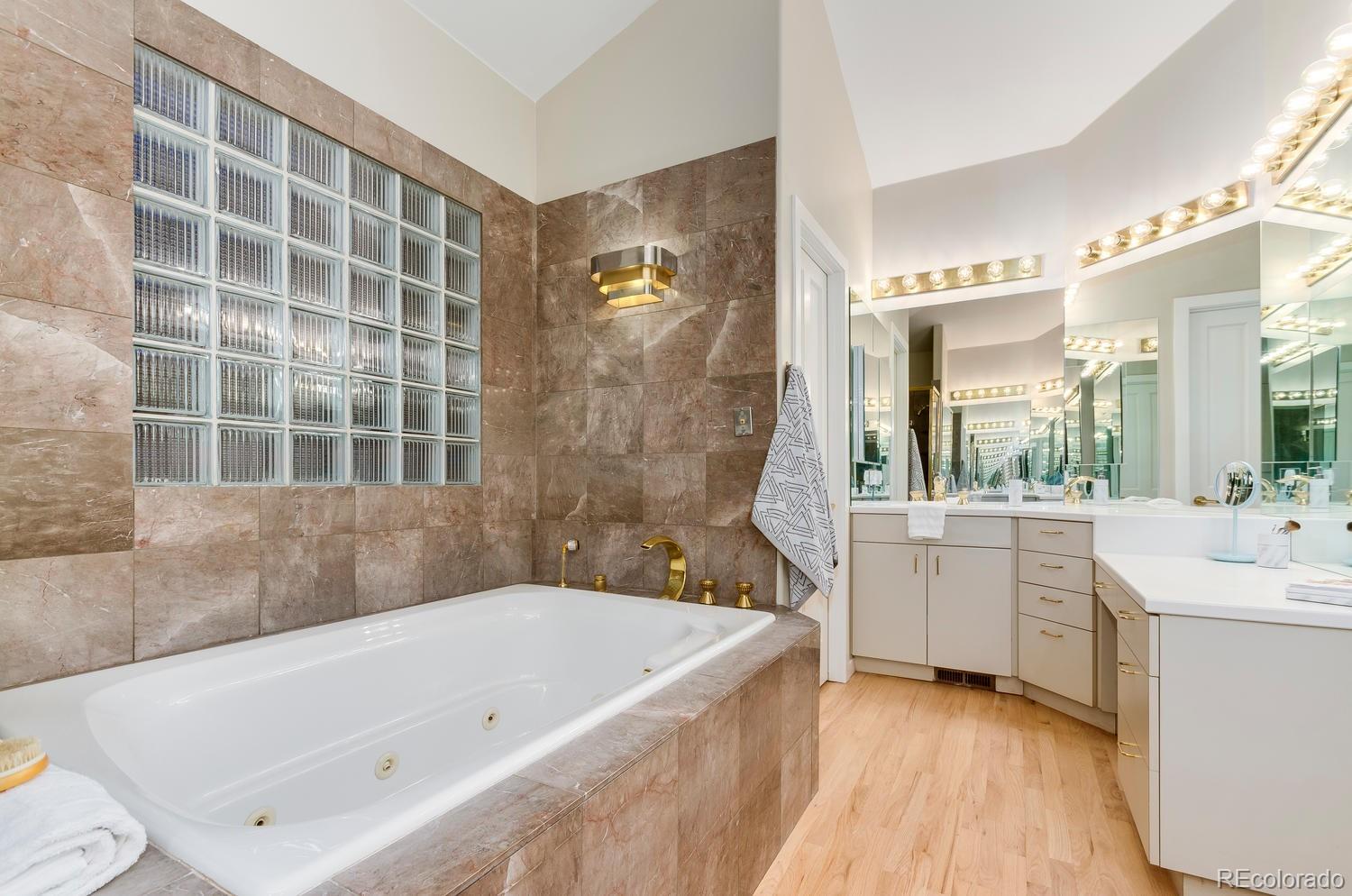 27 Hyde Park Circle Denver, CO 80209 - Photo 19 of 40 a bathroom with a bathtub and a sink