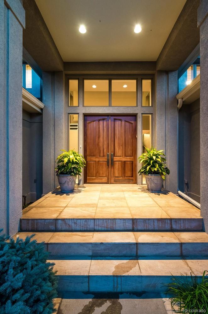 27 Hyde Park Circle Denver, CO 80209 - Photo 2 of 40 a bedroom with a bed and a large dresser
