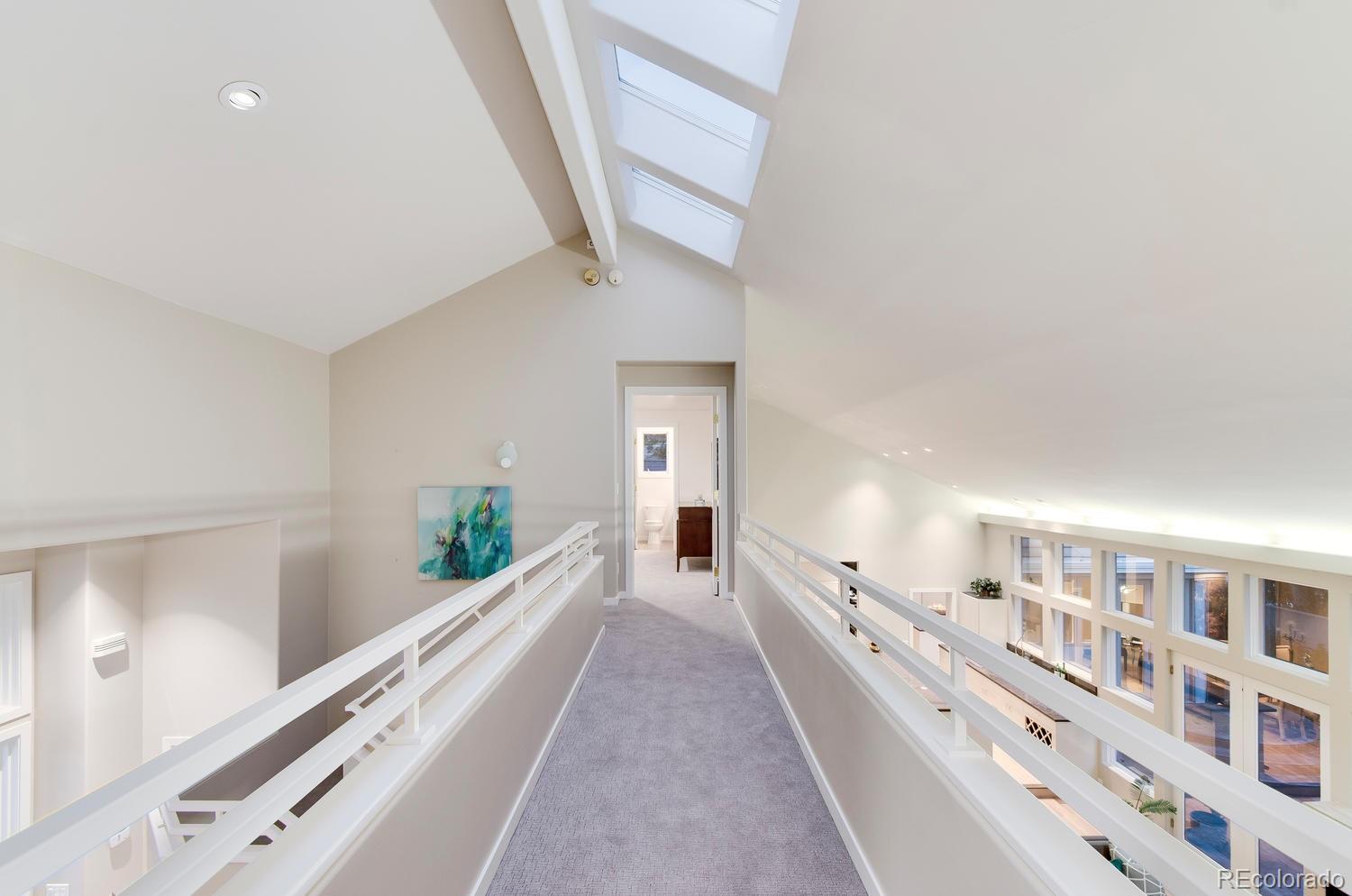 27 Hyde Park Circle Denver, CO 80209 - Photo 23 of 40 a view of a hallway with windows