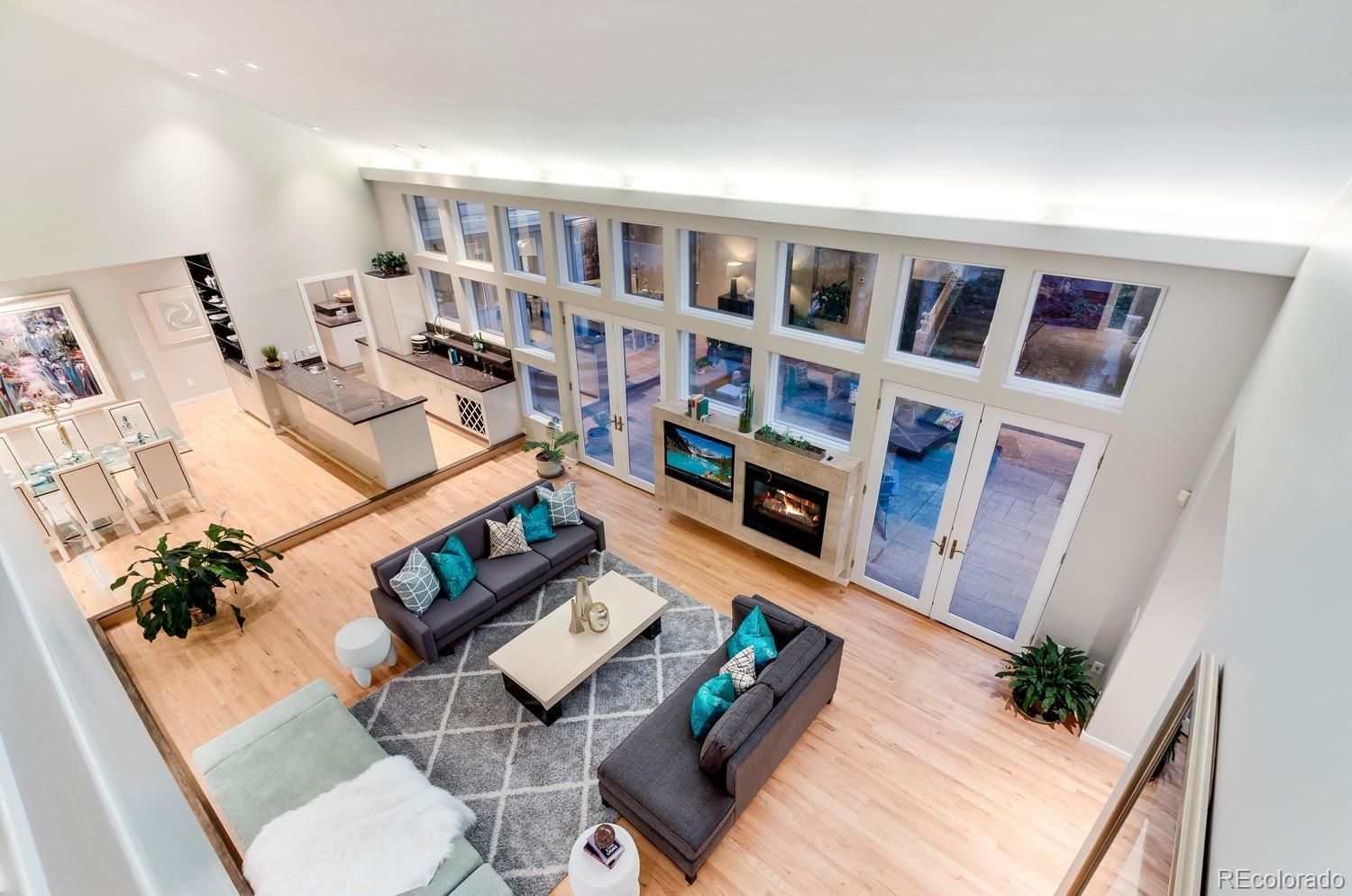 27 Hyde Park Circle Denver, CO 80209 - Photo 24 of 40 a living room with furniture and book shelf