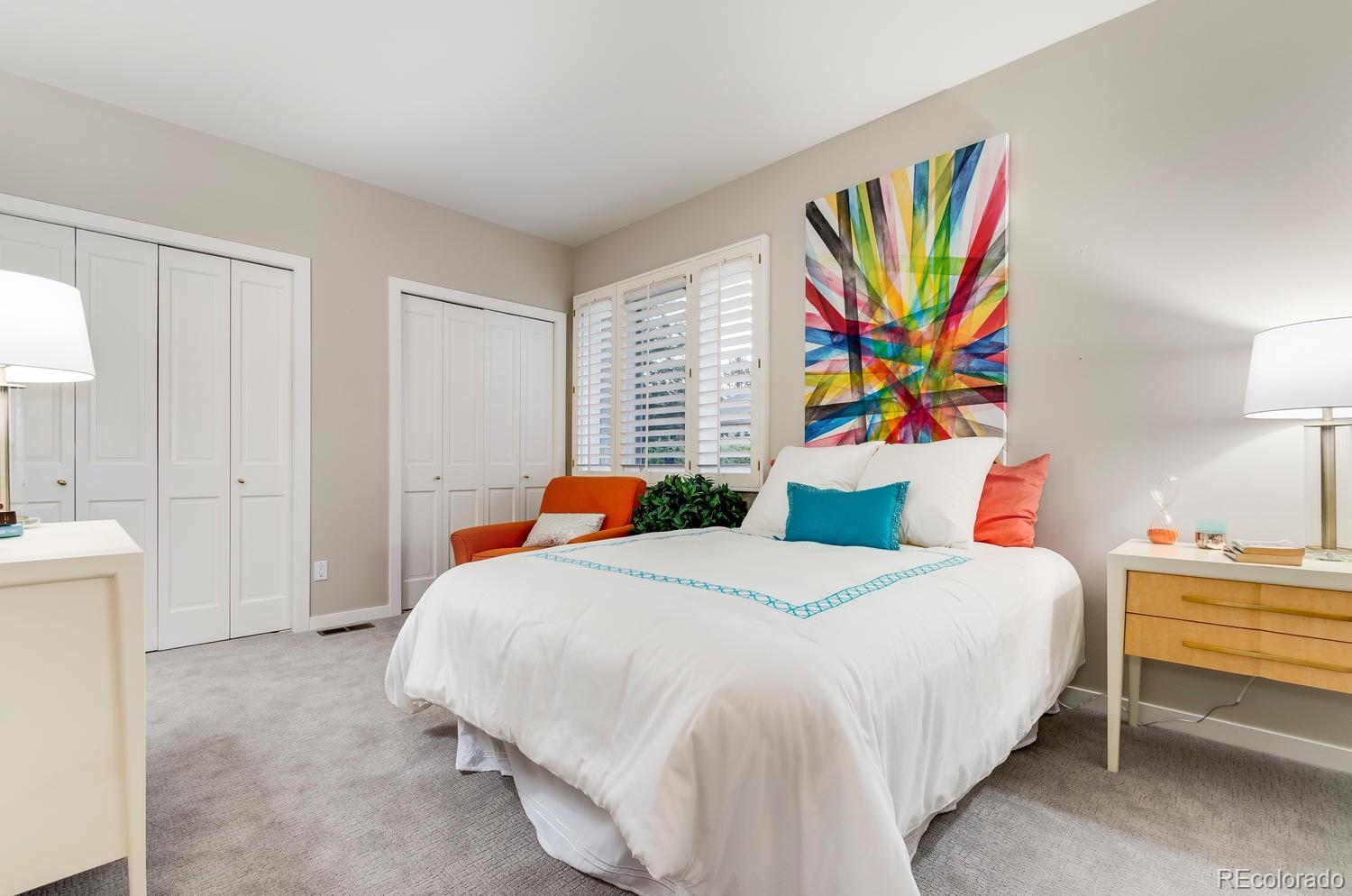 27 Hyde Park Circle Denver, CO 80209 - Photo 25 of 40 a bedroom with a bed a painting on the wall and a shower