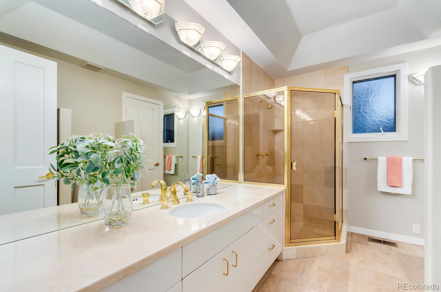 27 Hyde Park Circle Denver, CO 80209 - Photo 26 of 40 a bathroom with a double vanity sink mirror and shower