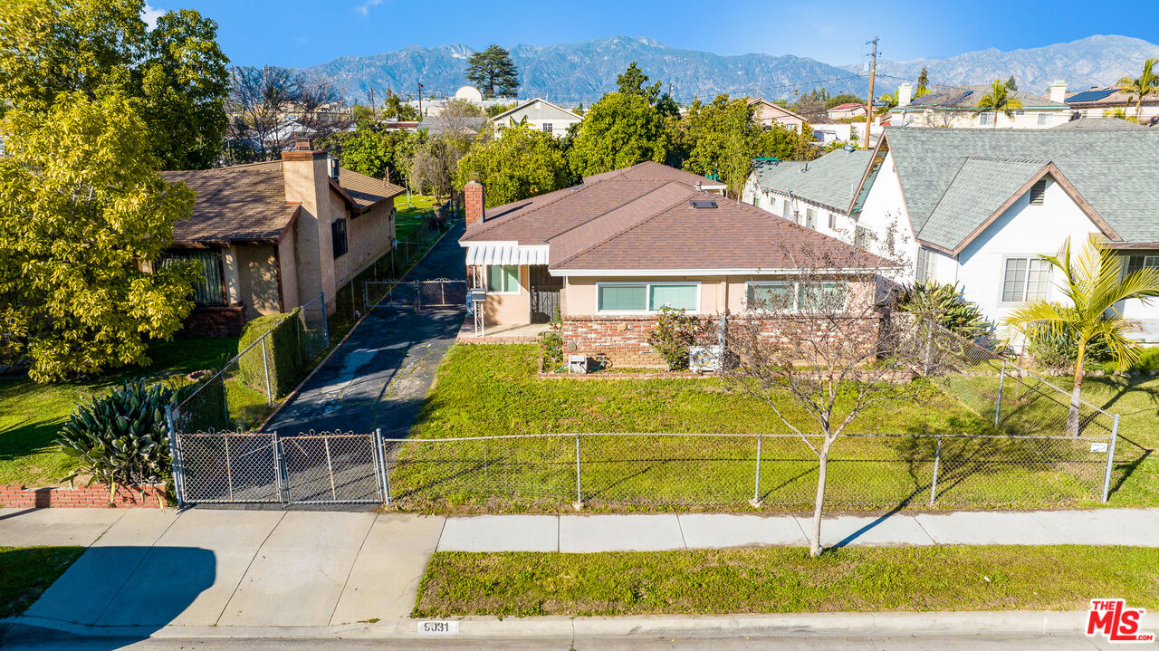 a view of a house with a swimming pool