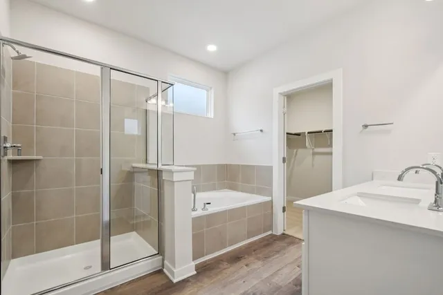 a bathroom with a shower and a sink
