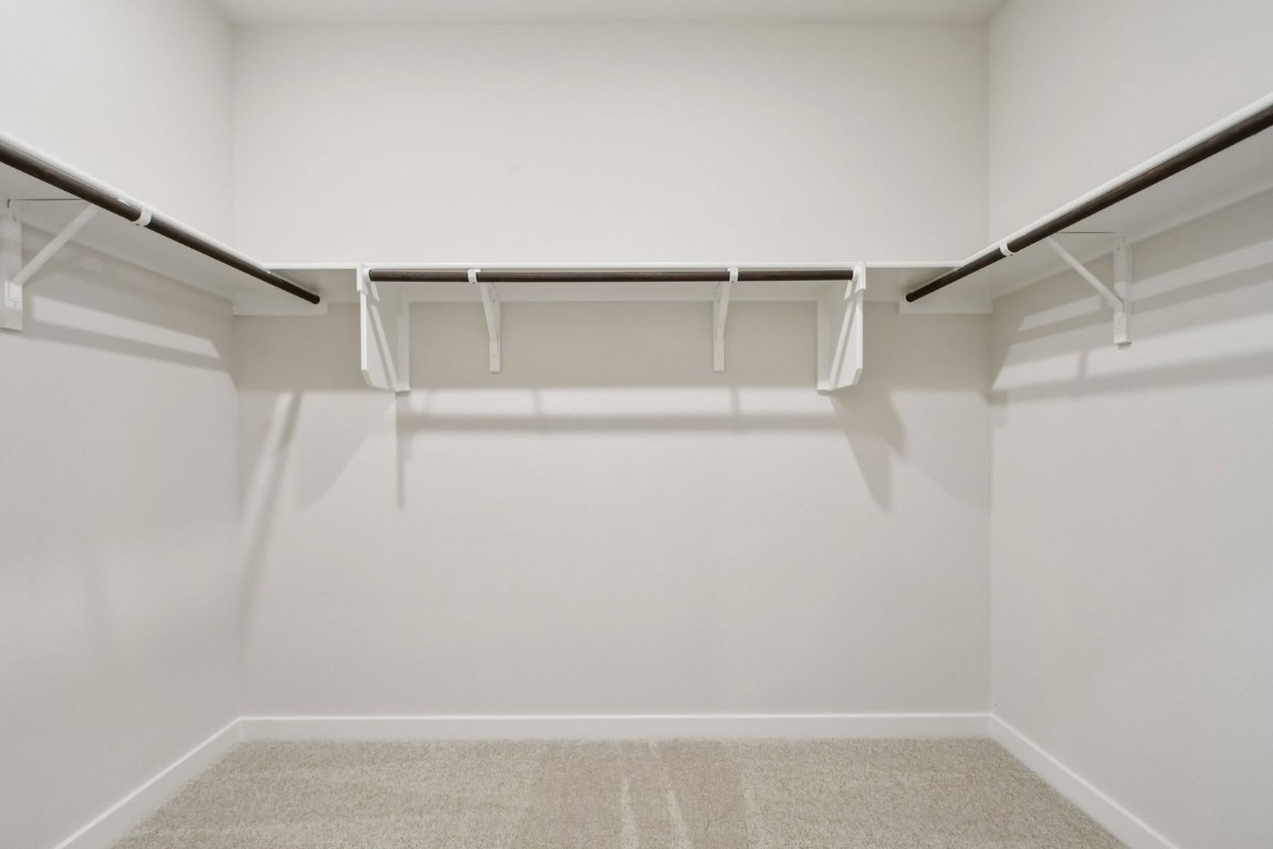 13417 Derby Ride Drive Buda, TX 78610 - Photo 22 of 38 a view of an empty walk in closet