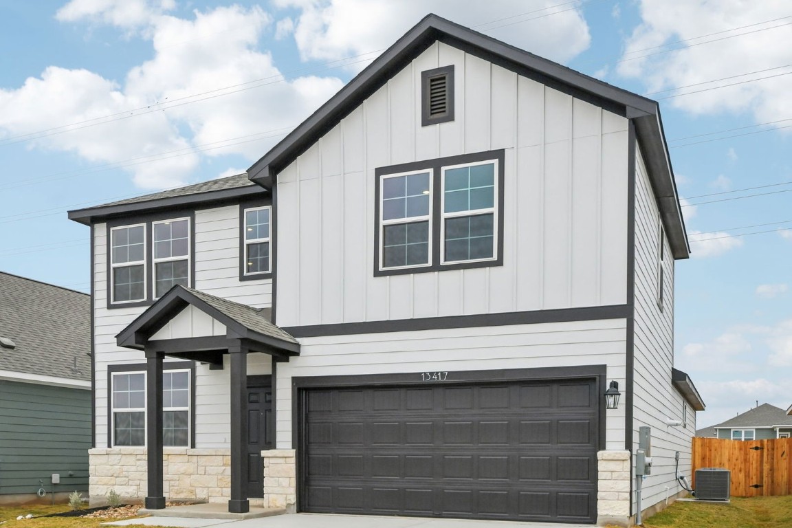 13417 Derby Ride Drive Buda, TX 78610 - Photo 4 of 38 a front view of a house with a porch