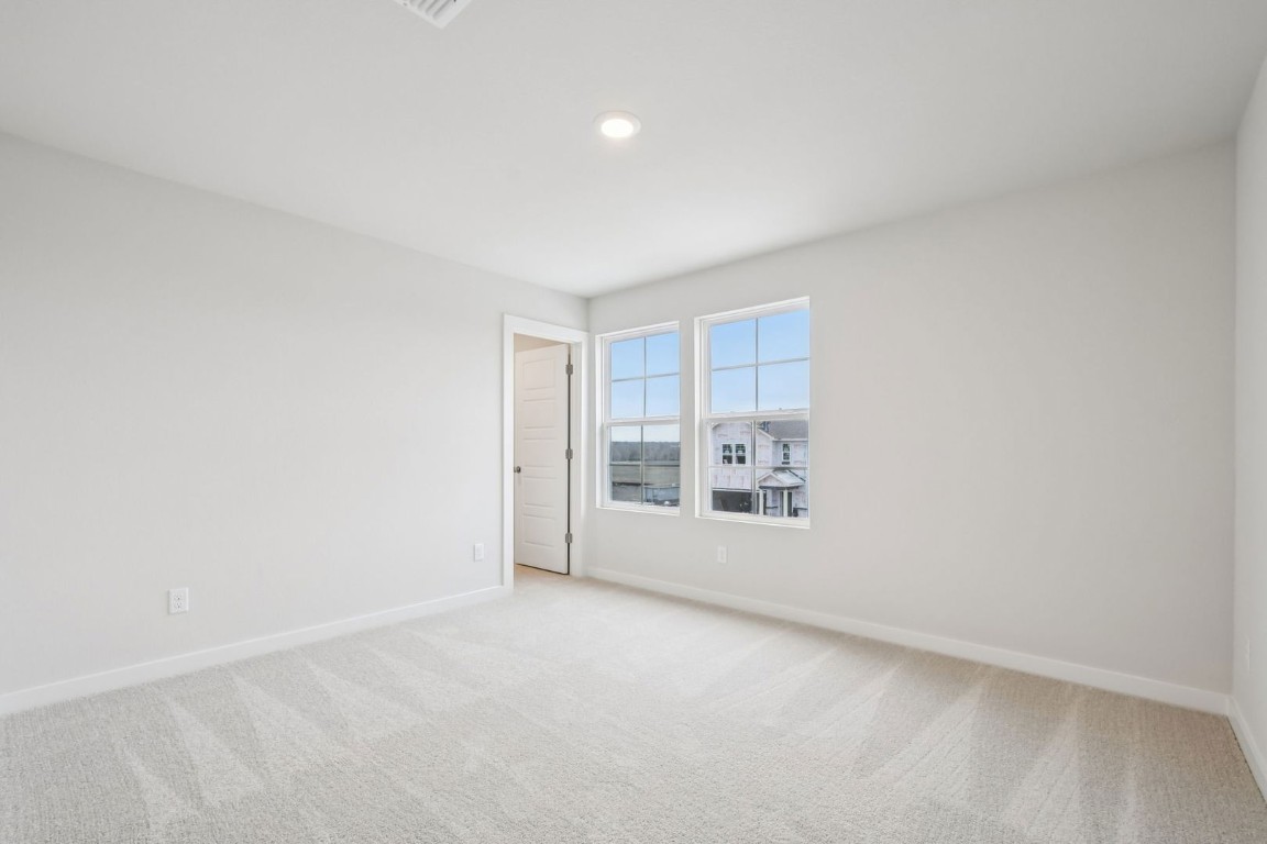 13417 Derby Ride Drive Buda, TX 78610 - Photo 5 of 38 a view of an empty room with a window