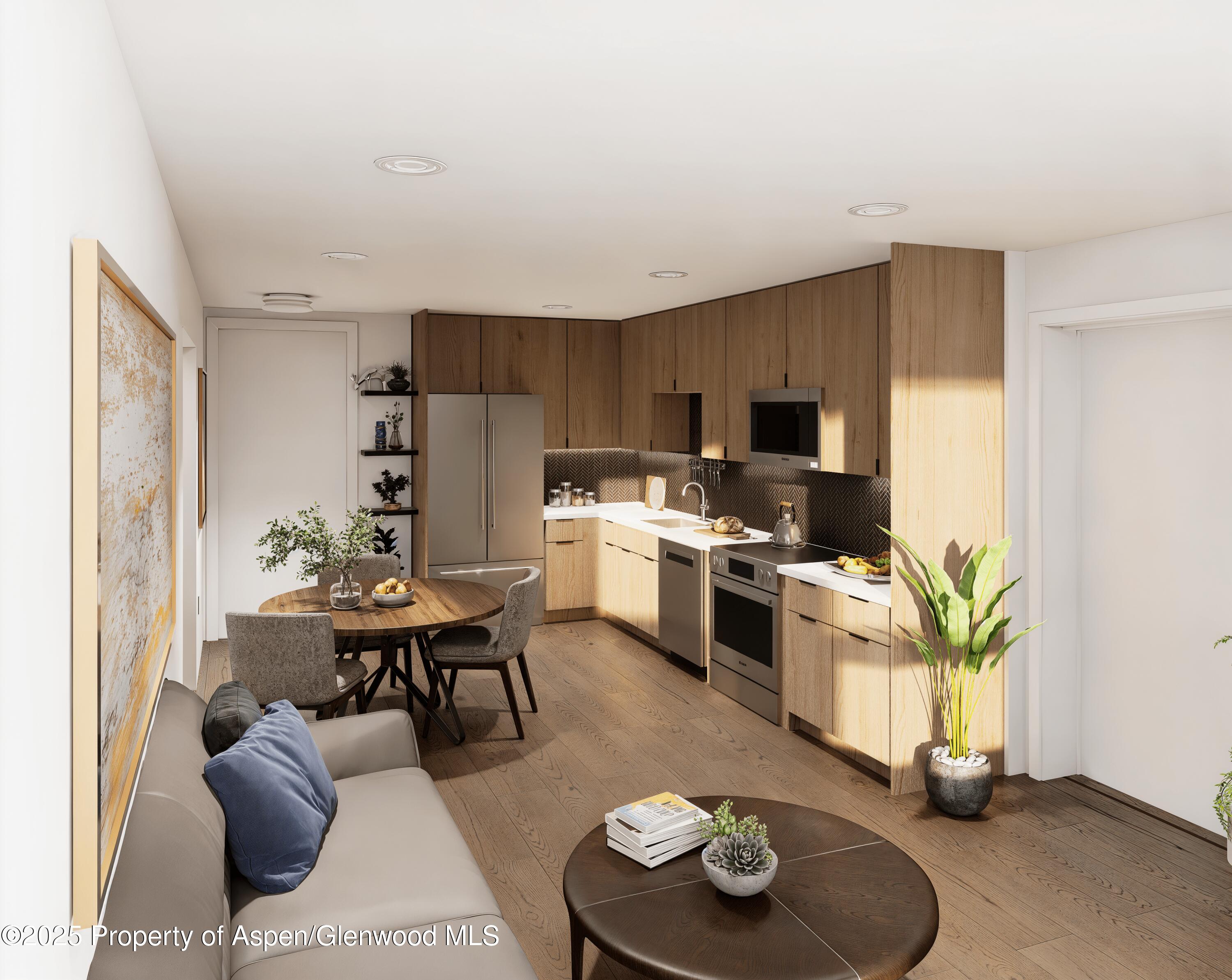 140 Basalt Center Circle, Unit 230 Basalt, CO 81621 - Photo 2 of 17 a living room with furniture and a fireplace
