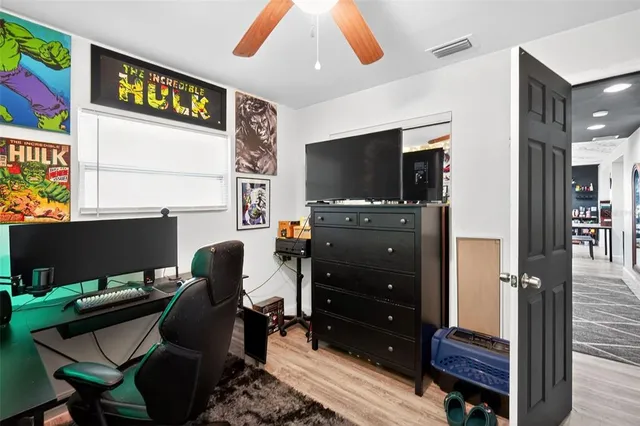 a view of a livingroom with furniture and a flat screen tv