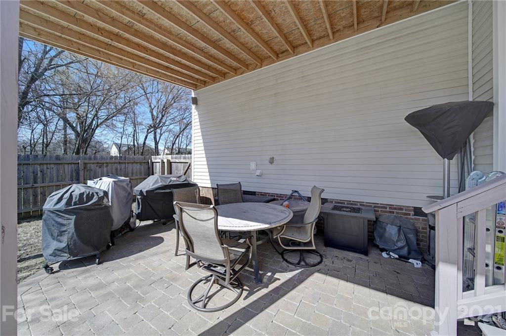 115 Anchura Road Fort Mill, SC 29708 - Photo 40 of 48 a view of a patio with a table and chairs