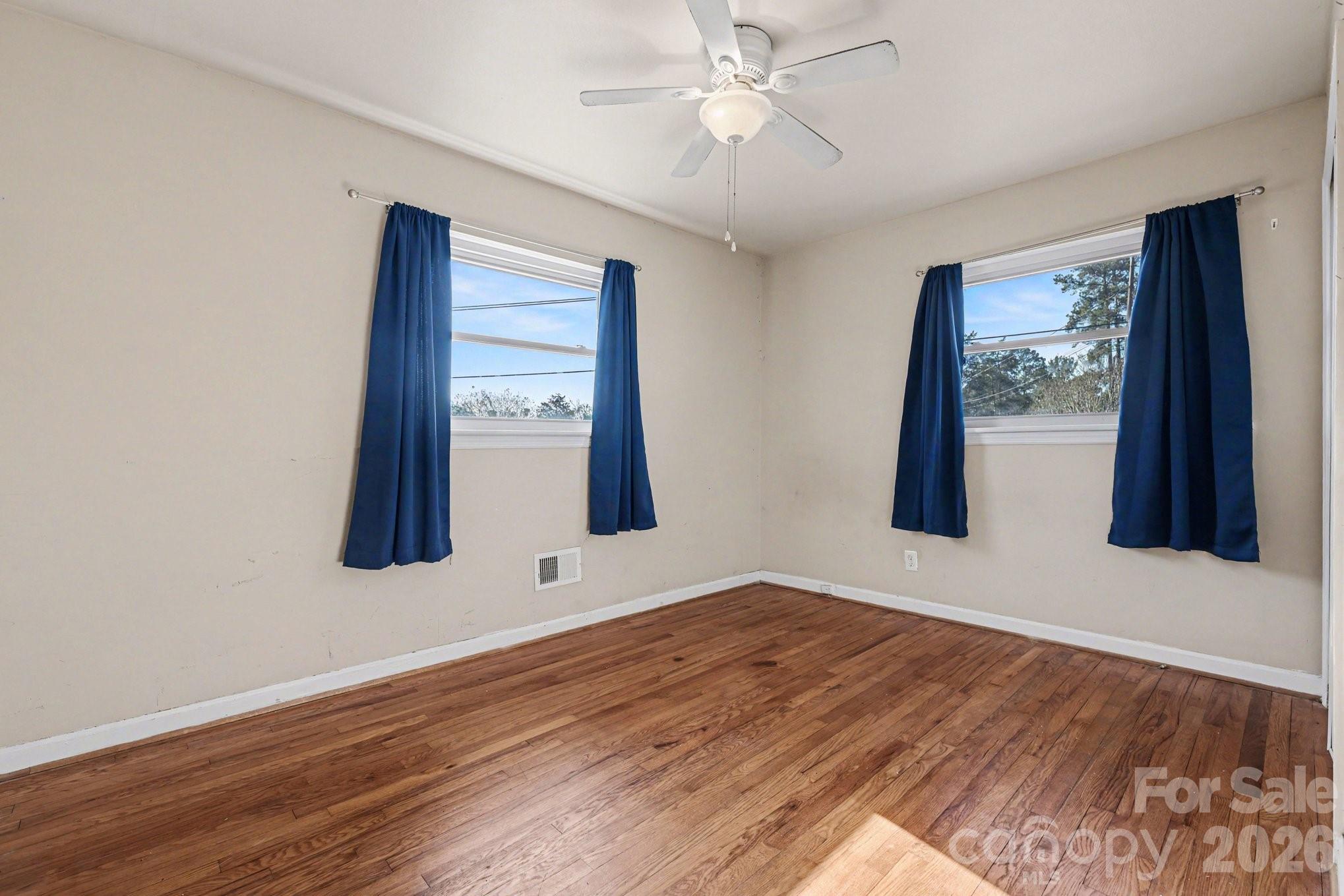 110 Abell Street Chester, SC 29706 - Photo 13 of 29 a view of an empty room with window and wooden floor