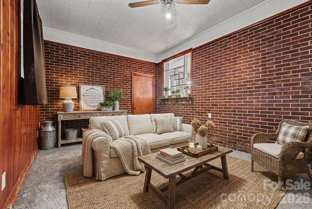 110 Abell Street Chester, SC 29706 - Photo 4 of 29 a living room with furniture and a potted plant