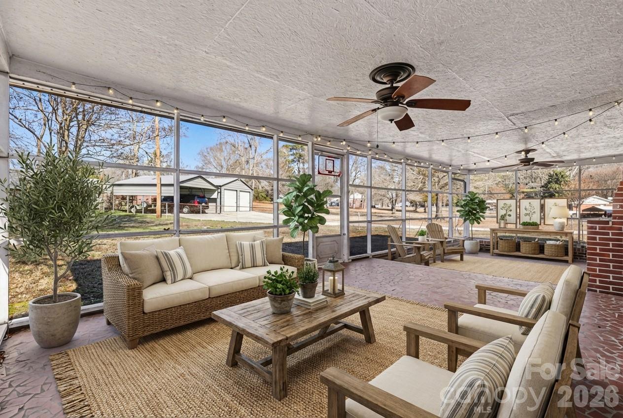 110 Abell Street Chester, SC 29706 - Photo 5 of 29 a living room with furniture kitchen view and a chandelier