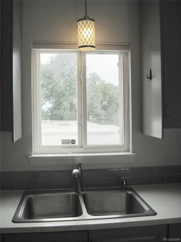 a kitchen that has a sink and a window