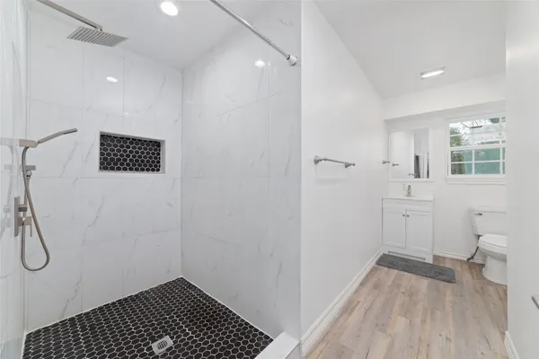 a bathroom with a sink and a shower
