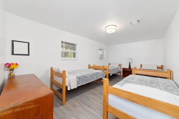 a bedroom with two beds and painted walls