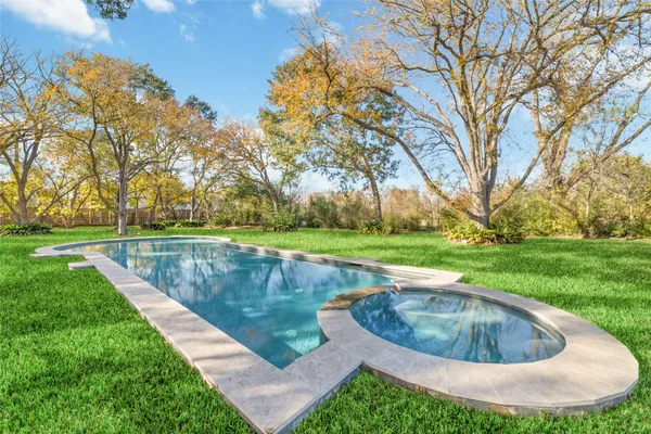 a view of a swimming pool with a garden