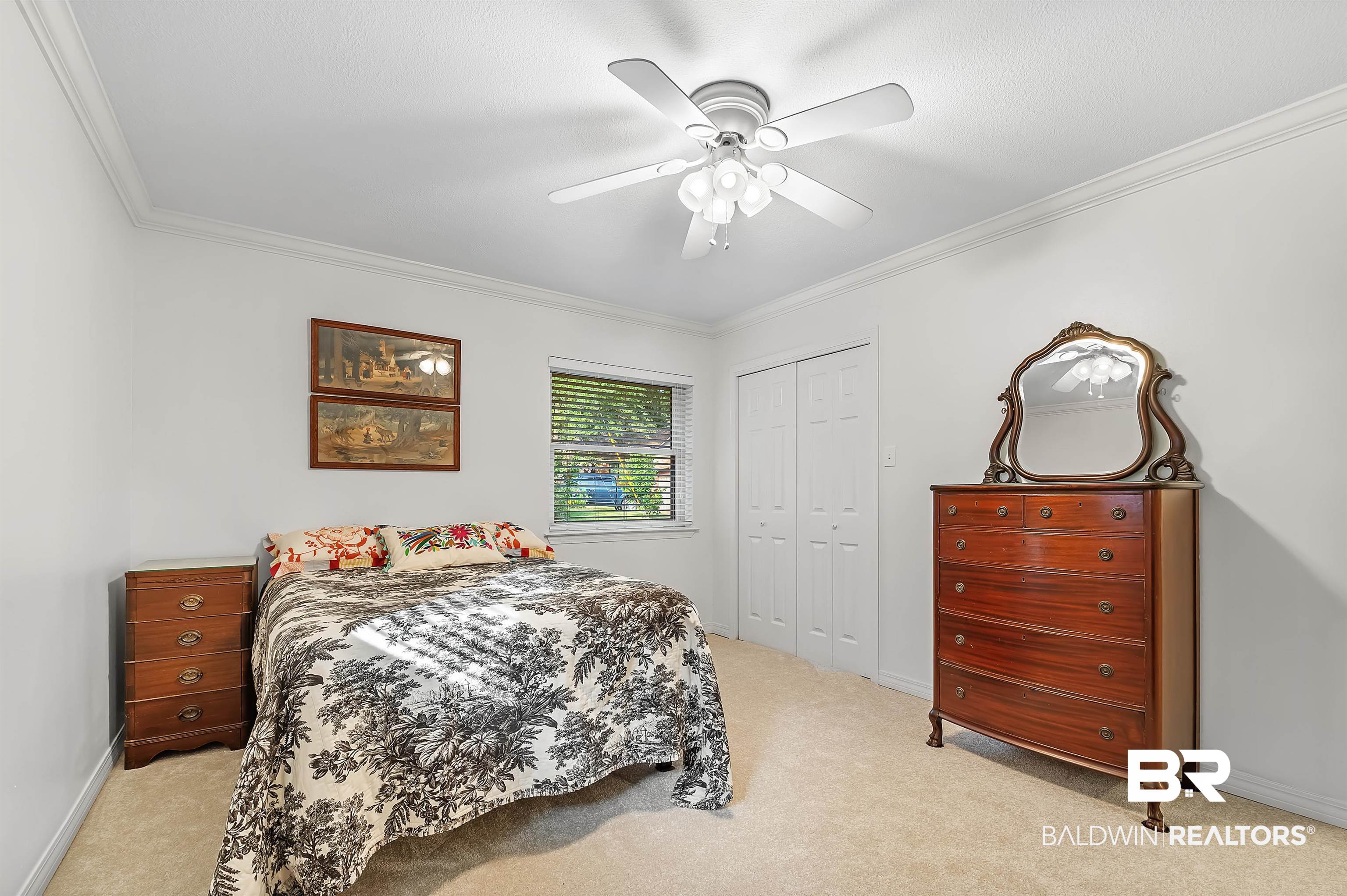104 James Circle Daphne, AL 36526 - Photo 52 of 62 Bedroom featuring ceiling fan, crown molding, light carpet, and a closet