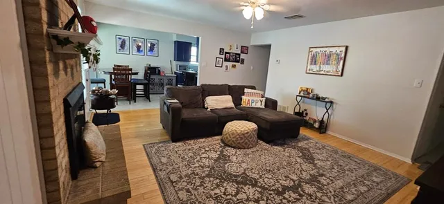 a living room with furniture and a rug