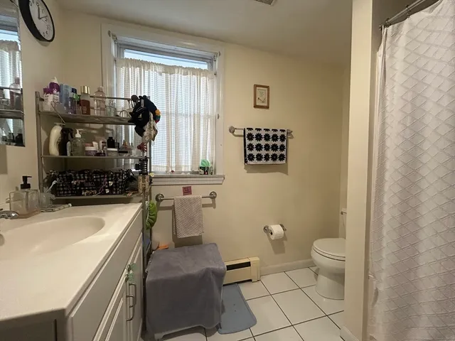 a kitchen with a sink appliances and cabinets