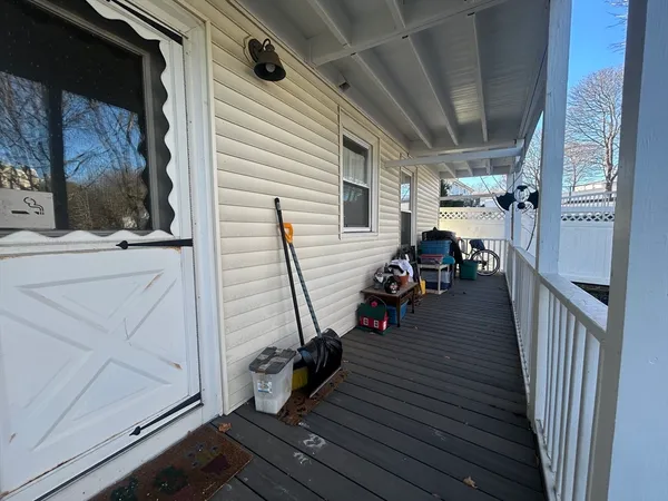 a view of a porch with wooden floor