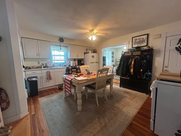 a view of a dining room with furniture and window