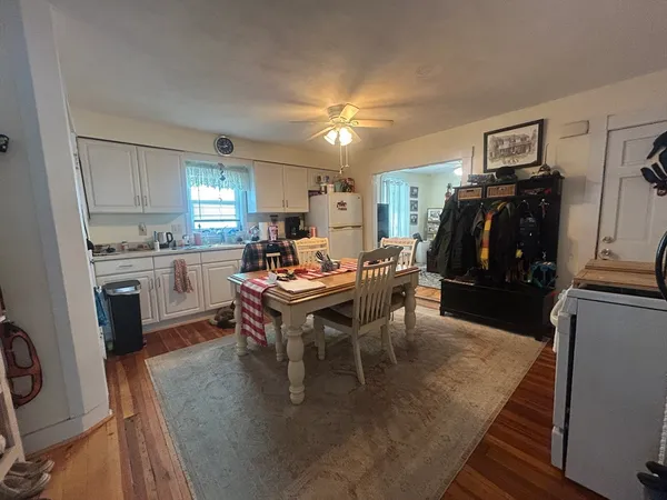 a view of a dining room with furniture and window