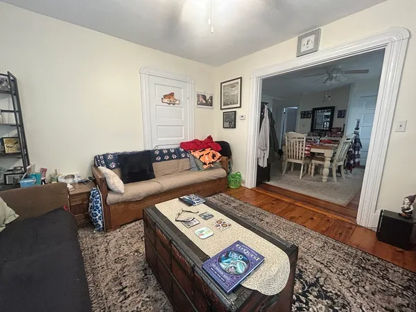 a living room with furniture and a rug