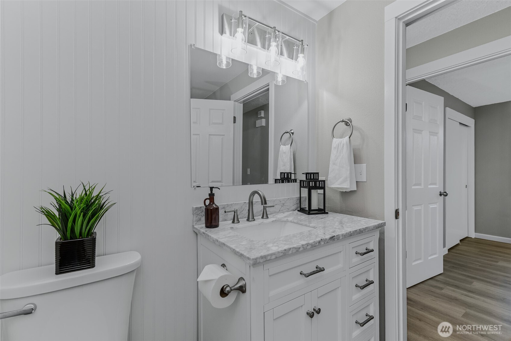 3162 Northwest Kent Street Camas, WA 98607 - Photo 24 of 40 a bathroom with a granite countertop sink a mirror and a potted plant