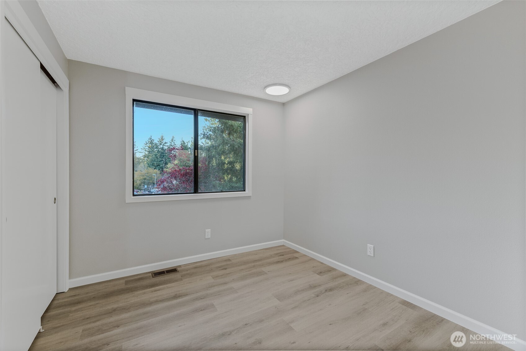 3162 Northwest Kent Street Camas, WA 98607 - Photo 27 of 40 wooden floor in an empty room with a window