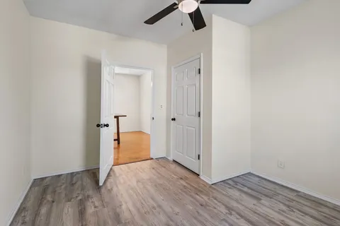 an empty room with wooden floor