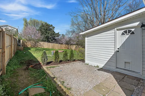 a view of a backyard with pathway