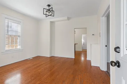 a view of a bathroom with wooden floor