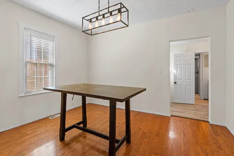 a view of a livingroom with furniture and wooden floor