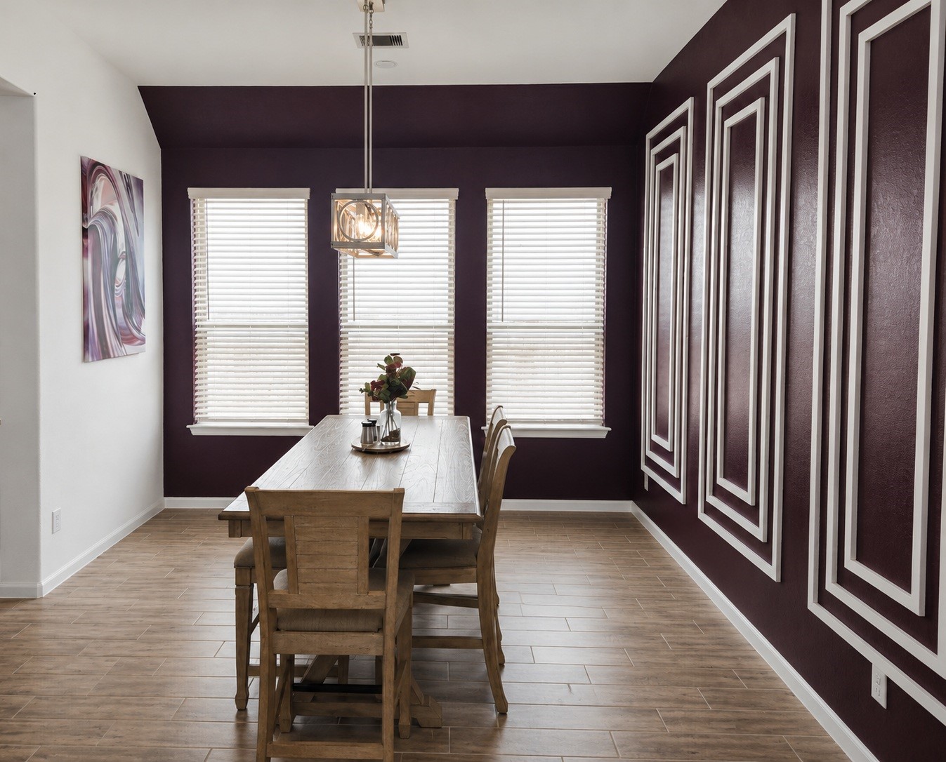 5035 Sierra Ridge Drive Rosenberg, TX 77469 - Photo 4 of 26 Discover a stylish dining room featuring striking accent walls and elegant paneling, perfect for memorable gatherings.