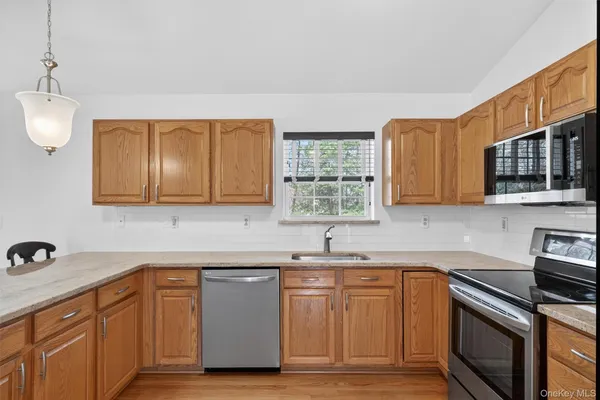 a kitchen with a sink cabinets and window
