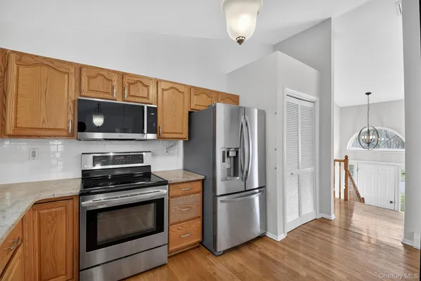 a kitchen with a sink microwave and refrigerator