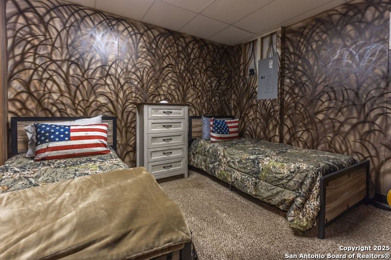 985 County Road 316 Christoval, TX 76935 - Photo 7 of 19 a bedroom with a bed and a chair