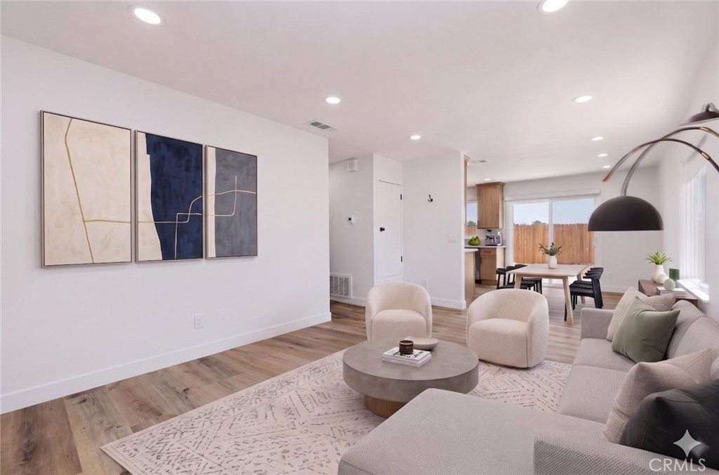 6940 Keating Drive Riverside, CA 92503 - Photo 3 of 15 a living room with furniture and wooden floor