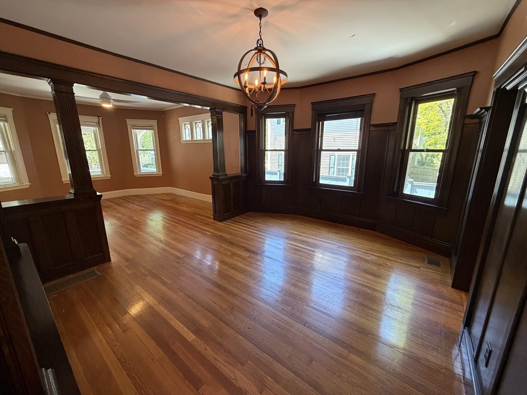 12-14 Warwick Road, Unit 12 Belmont, MA 02478 - Photo 10 of 15 a view of big room with wooden floor and windows