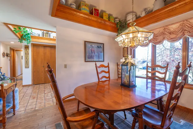 a dining room with furniture and window